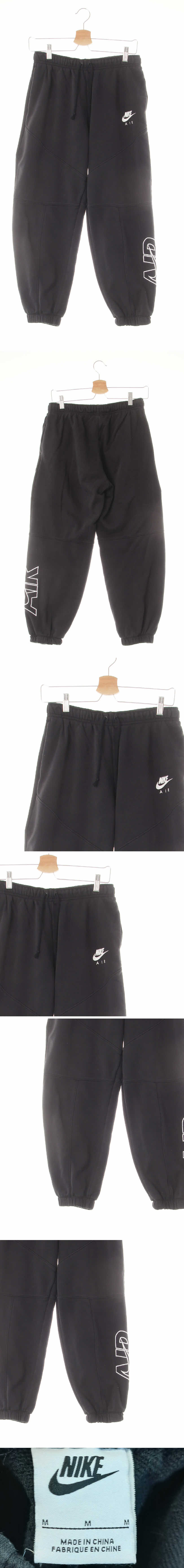 나이키 언발절개라인로고트레이닝팬츠 나이키 블랙 면혼방 언발절개라인로고트레이닝팬츠